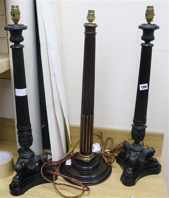 A pair of Louis Philippe style bronzed effect table lamps and a mahogany and gilt table lamp